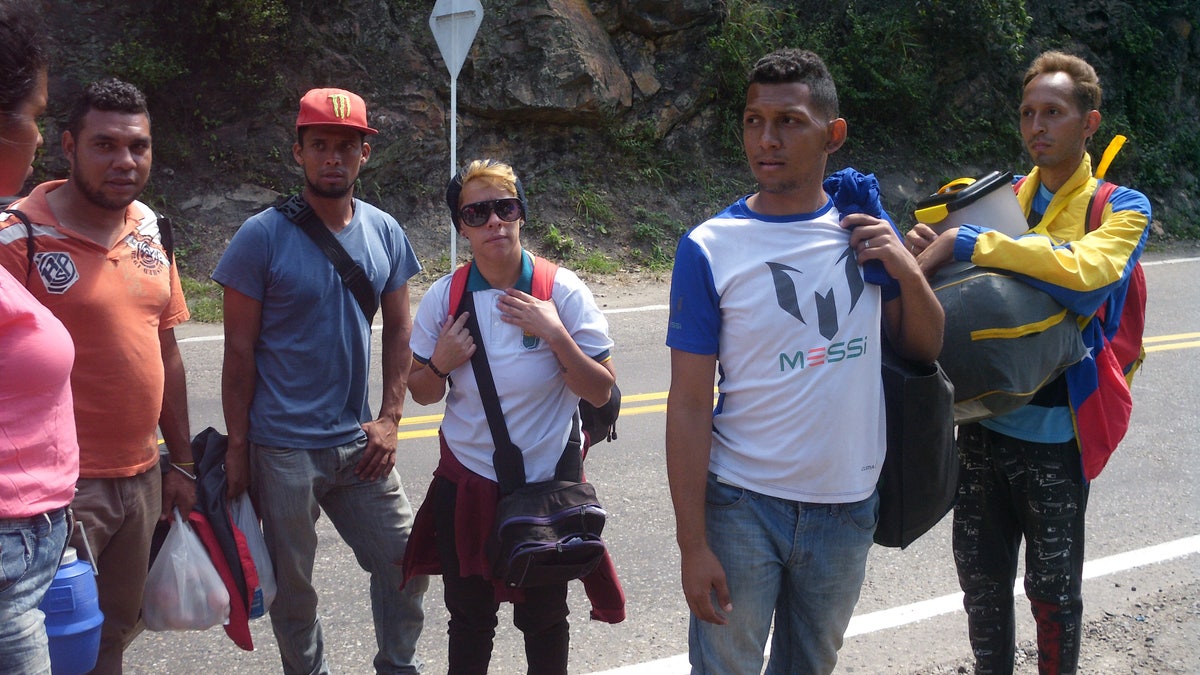 Scores flee Venezuela on foot, often making dangerous treks through Colombia