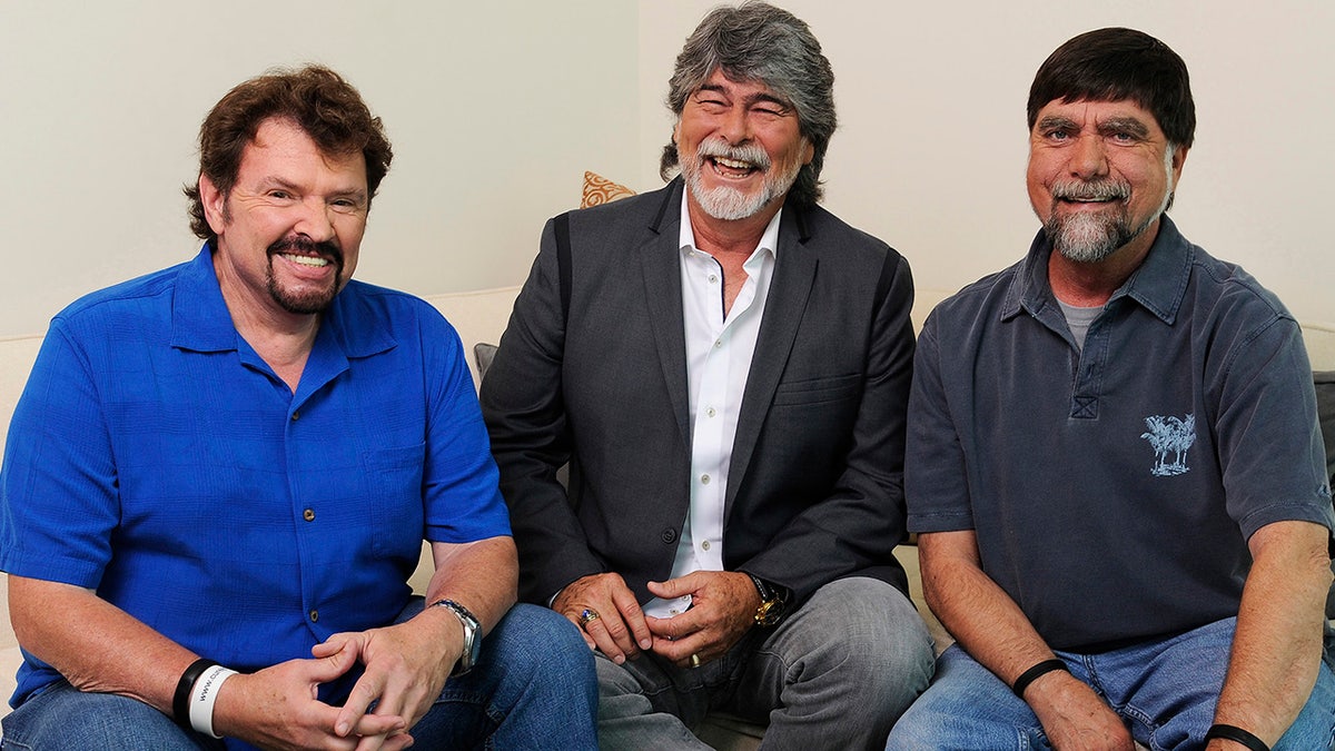 FILE - In this Aug. 13, 2013, file photo, Jeff Cook, from left, Randy Owen and Teddy Gentry from the American country music band Alabama pose for a portrait in Nashville, Tenn. Country band Alabama to mark 50 years together with a new tour in 2019, more than a year after founding member Cook announced that he has Parkinson’s disease. Cook will join band members Owen and Gentry on the tour as much as physically possible on the tour that begins Jan. 10 in Detroit. (Photo by Donn Jones/Invision/AP, File)