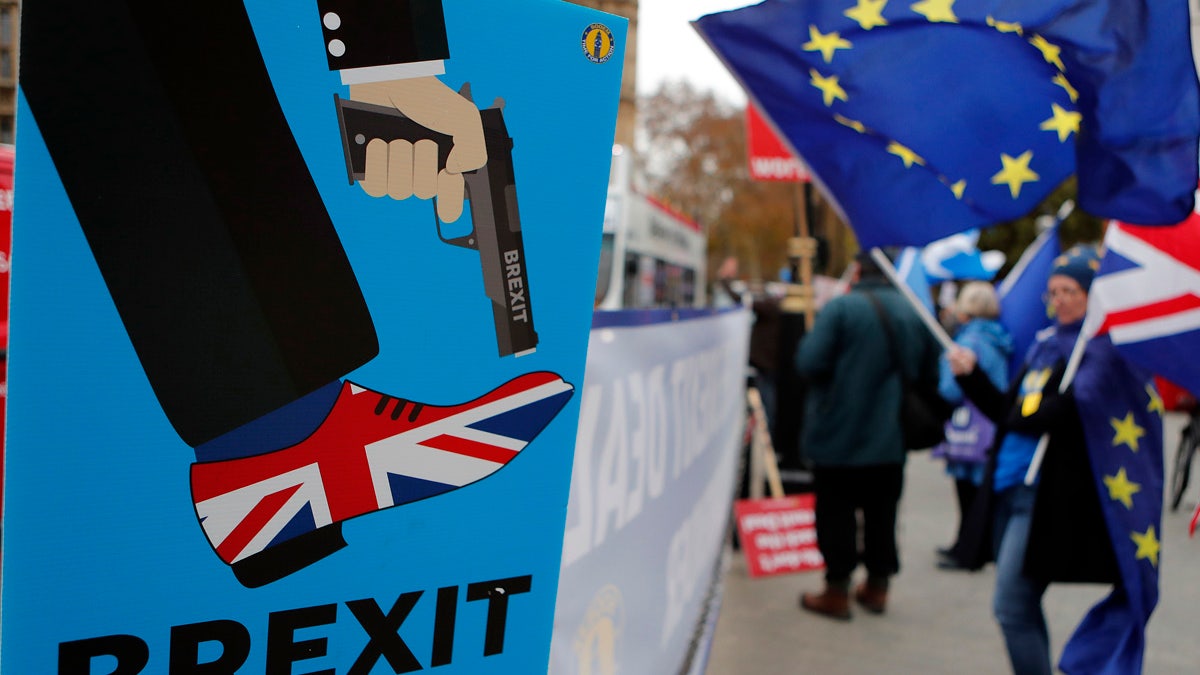 Protestors demonstrate opposite Parliament against Britain's Brexit split from Europe, in London, Thursday, Dec. 6, 2018.