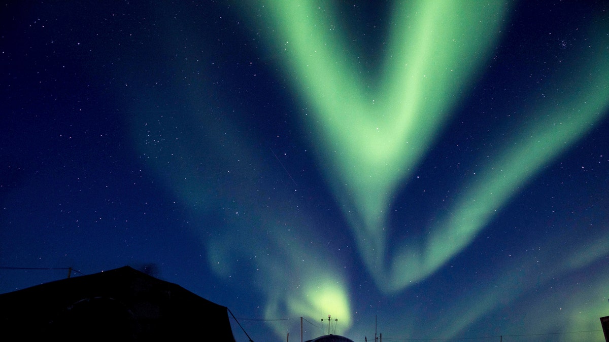 FILE - In this March 9, 2018, file photo provided by the U.S. Navy, the aurora borealis displays above Ice Camp Skate in the Beaufort Sea during Ice Exercise (ICEX) 2018. Scientists are seeing surprising melting in Earth's polar regions at times they don't expect, like winter, and in places they don't expect, like eastern Antarctica. (MC 2nd Class Micheal H. Lee/U.S. Navy via AP, File)