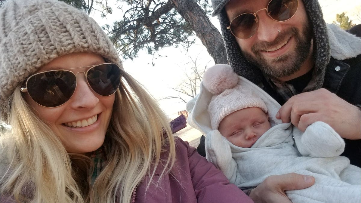 Taylor Smith, pictured with his baby Hazel and fiance Michelle Arnold, did not realize he was colorblind until he failed a test on Facebook.