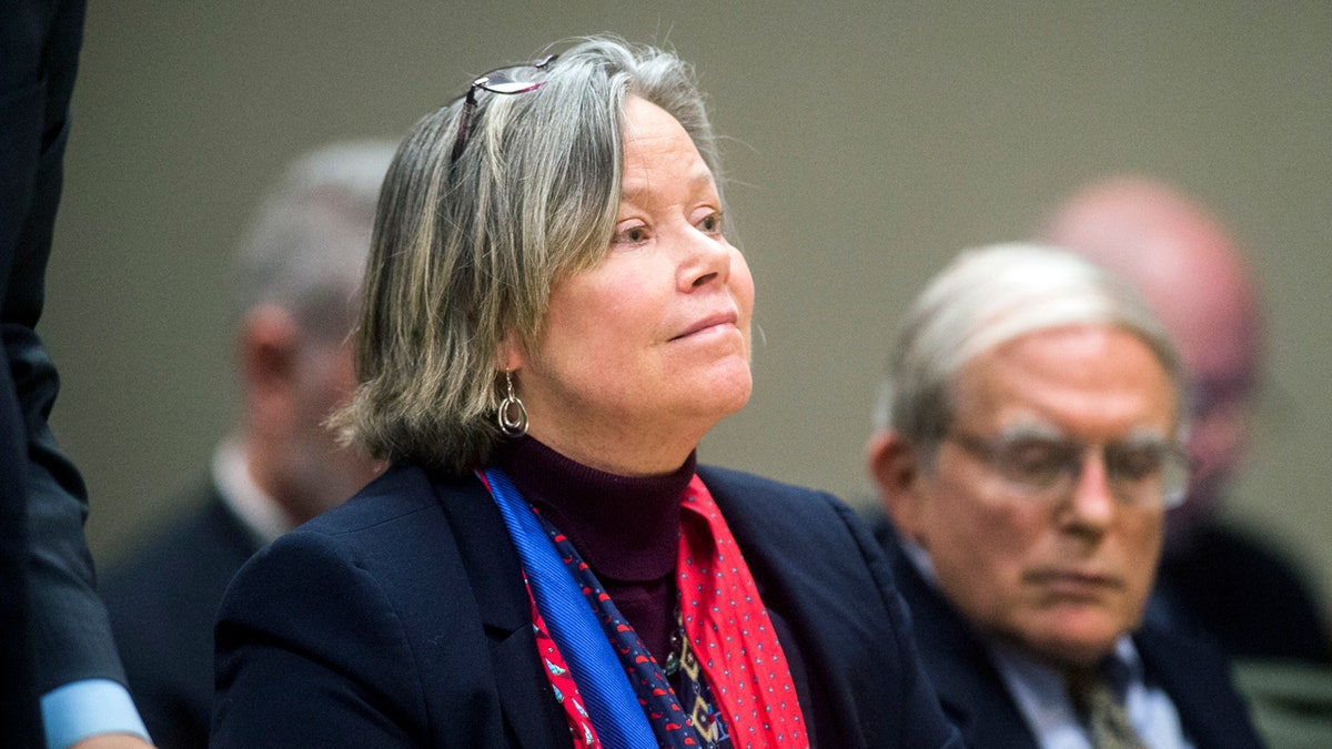 Dr. Eden Wells listens as Genesee District Judge William Crawford reads through a prepared statement during a hearing Friday, Dec. 7, 2018, at Genesee District Court in downtown Flint, Mich. (Jake May/The Flint Journal via AP)