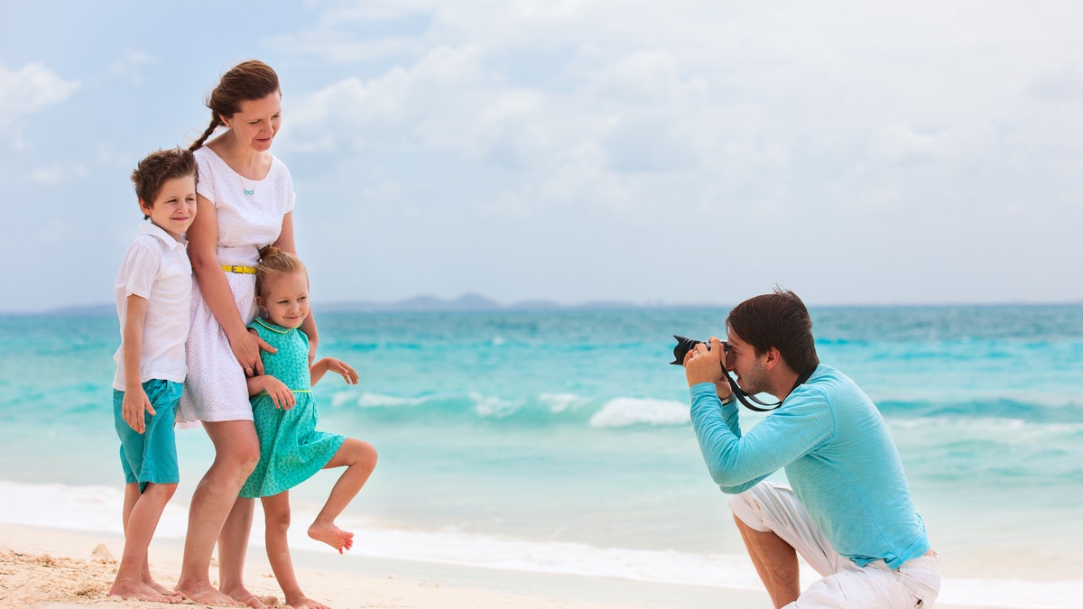 A British family is hiring a professional photographer to follow them around the world for a year  – and the money and the travel experiences aren't the only perks.