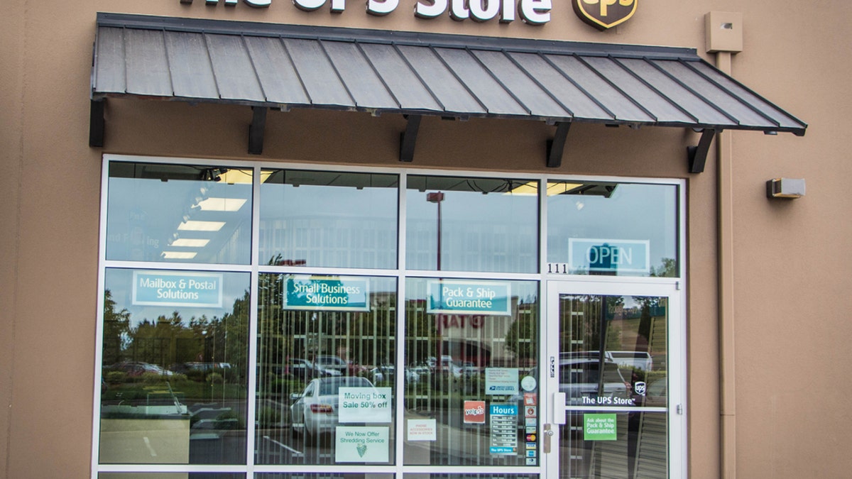 A building housing a UPS Store with large windows