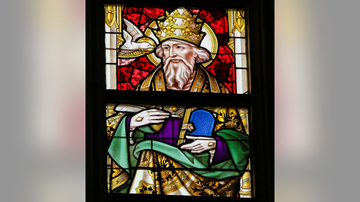 The Library of Congress says Pope Gregory, depicted here in a stained-glass  portrait, declared that all who sneeze require a blessing.