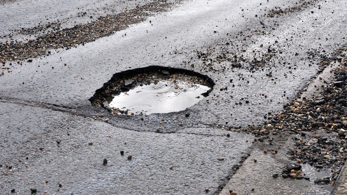 A pothole may now be fixed after residents decided to decorate it for the season.