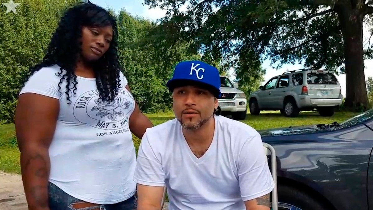 In this June 21, 2017 image taken from video, Richard Anthony Jones, right, with his girlfriend Nakisha Duncan of Kansas City at his side, talks about being released from prison in Kansas City, Mo.