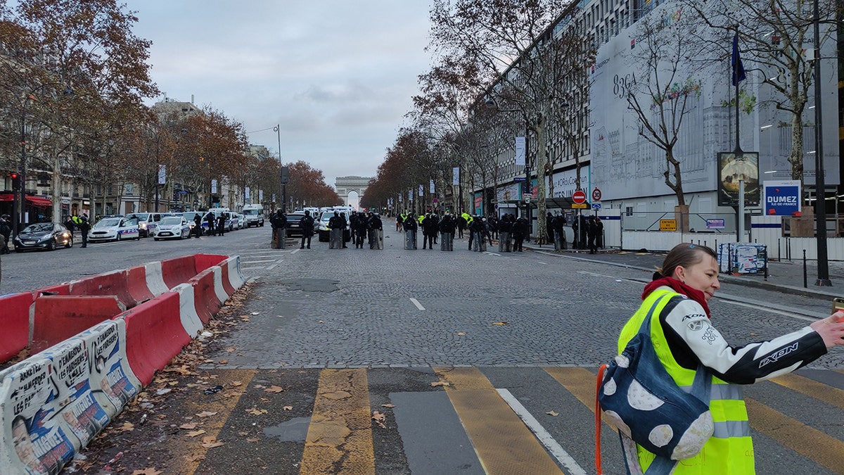 The scene in Paris early Saturday, Dec. 8, 2018, with the Arc de Triomphe far in the background. (Lukas Mikelionis/Fox News)