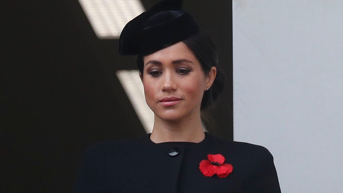 FILE - In this Nov. 11, 2018 file photo, Meghan Markle, Duchess of Sussex, attends the Remembrance Sunday ceremony at the Cenotaph in London. Meghan Markle’s father appealed to his daughter to call him, saying on Monday, Dec. 17, 2018, that they hadn’t been in touch since her wedding to Prince Harry in May. (AP Photo/Alastair Grant, File)