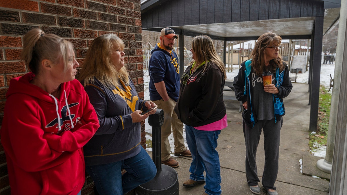 Family and friends await word of the search teams' efforts in finding Cody Beverly, Kayla Williams and Erica Treadway at the Salamy Memorial Center in Whitesville, W.Va., on Wednesday, December 12, 2018.