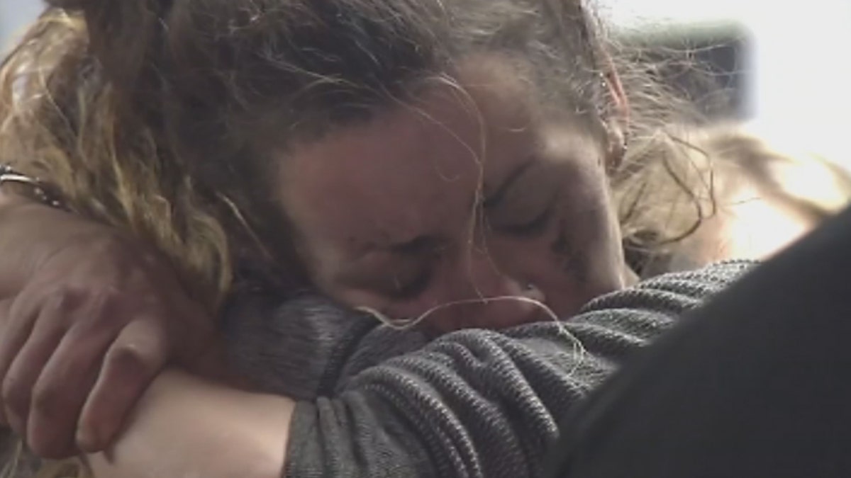 Kayla Williams embraces a loved one after being rescued from the mine on Wednesday.