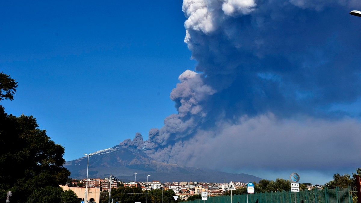 A smoke column comes out of the Etna volcano in Catania, Italy, Monday, Dec. 24, 2018.