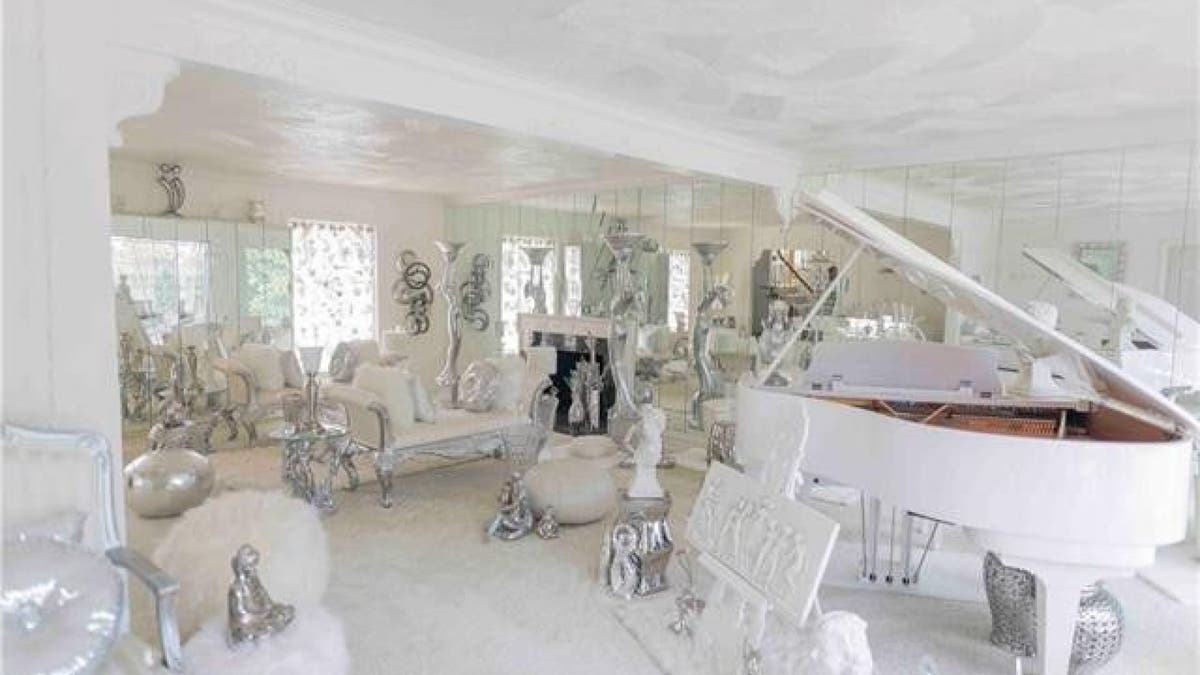 The home comes "as is," which includes a Kohler Campbell baby grand player piano. (Realtor.com)