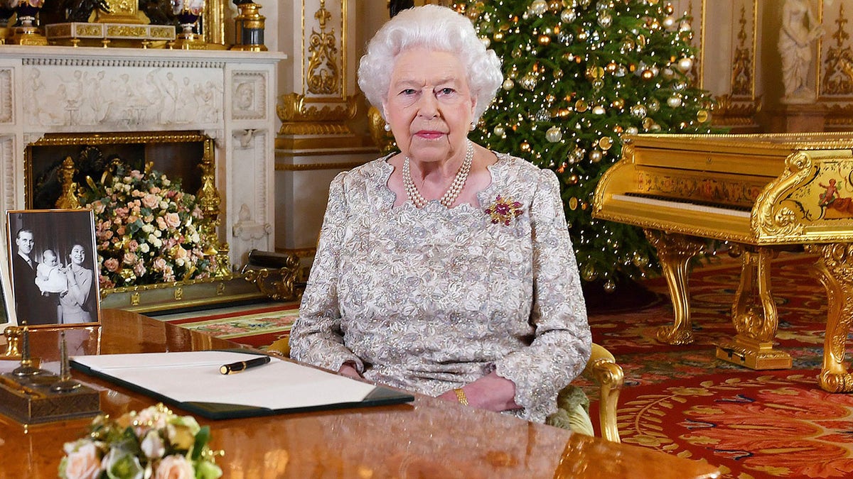 In this photo released on Monday, Dec. 24, 2018, Queen Elizabeth II poses after she recorded her annual Christmas Day message, in the White Drawing Room of Buckingham Palace in central London. (John Stillwell/Pool Photo via AP)