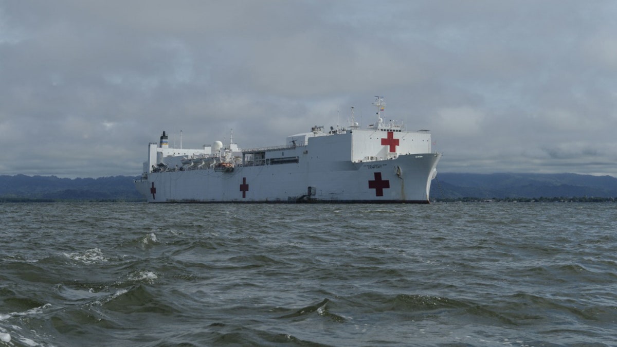 The hospital ship USNS Comfort (T-AH 20) is anchored off the coast of Colombia to offer medical treatment aboard the ship and at a land-based medical site.