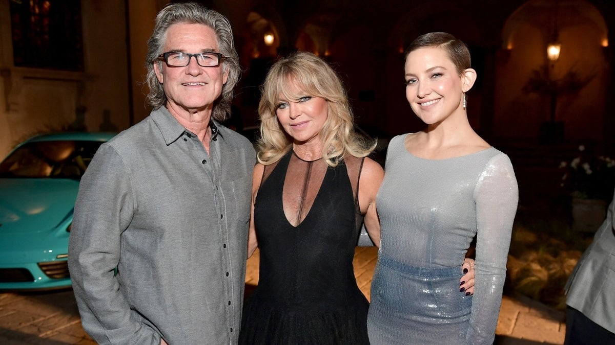 Kate Hudson shared an adorable photo of her mother Goldie Hawn and Kurt Russell holding her baby daughter.