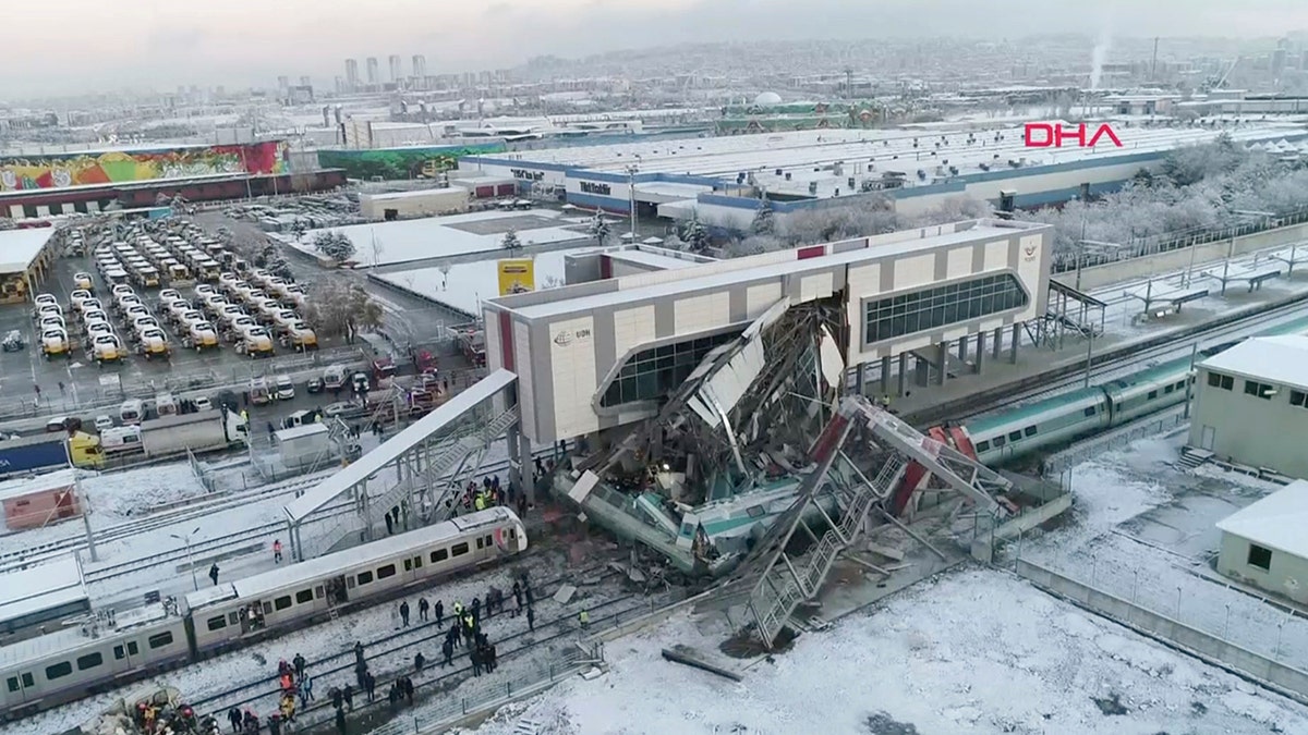 This image made from video shows aftermath of a high-speed train crash at a station in Ankara, Turkey, Thursday, Dec. 13, 2018. The train hit a railway engine and crashed into a pedestrian overpass at the station on Thursday. (DHA via AP)