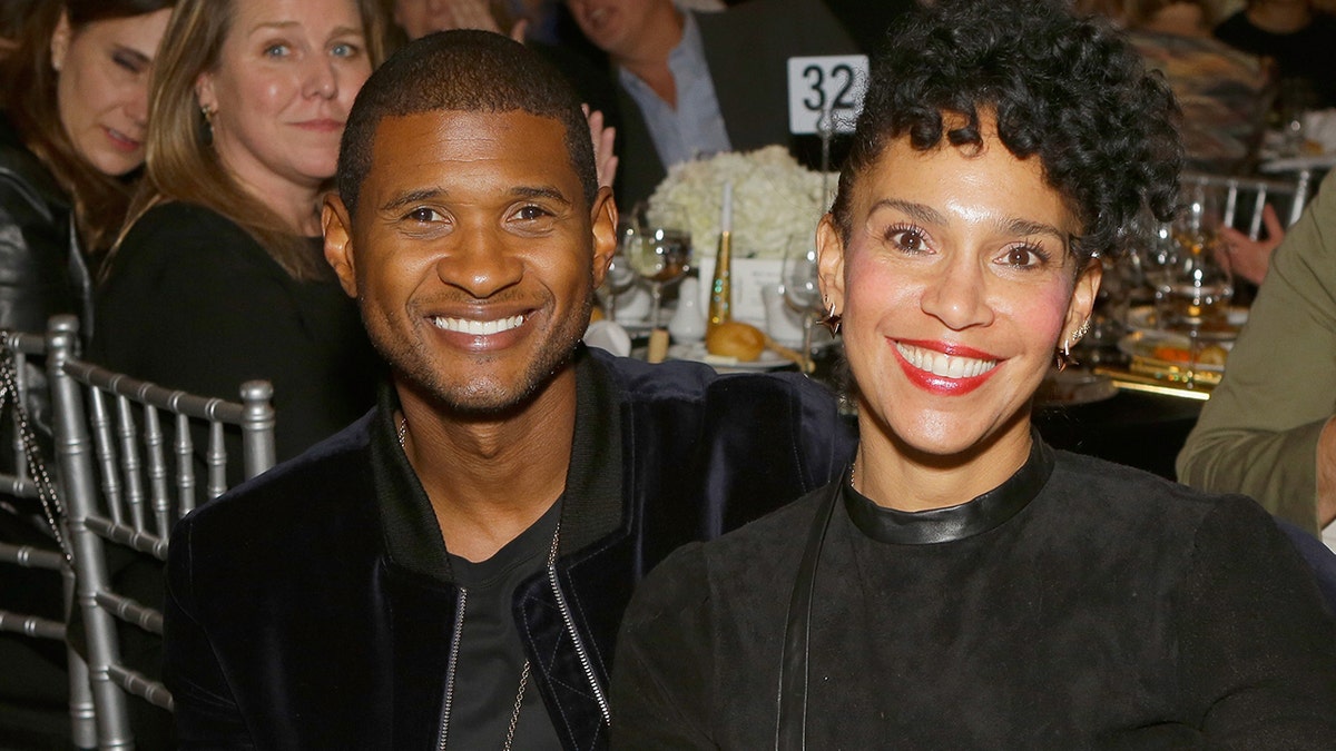 LOS ANGELES, CA - NOVEMBER 09: Singer-songwriter Usher Raymond IV (L) and Grace Miguel at the 2017 Make a Wish Gala on November 9, 2017 in Los Angeles, California. (Photo by Tiffany Rose/Getty Images for Make A Wish)