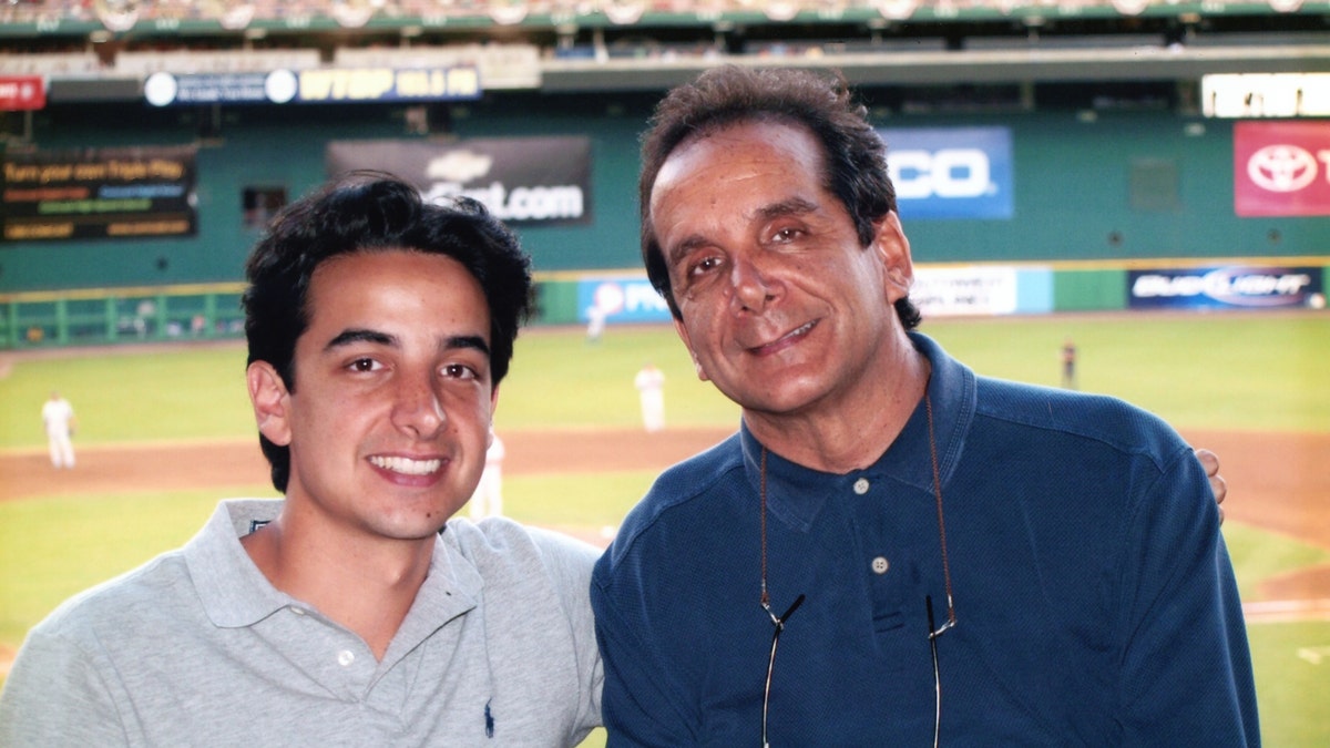 Charles Krauthammer with his son Daniel at RFK Stadium in 2007.