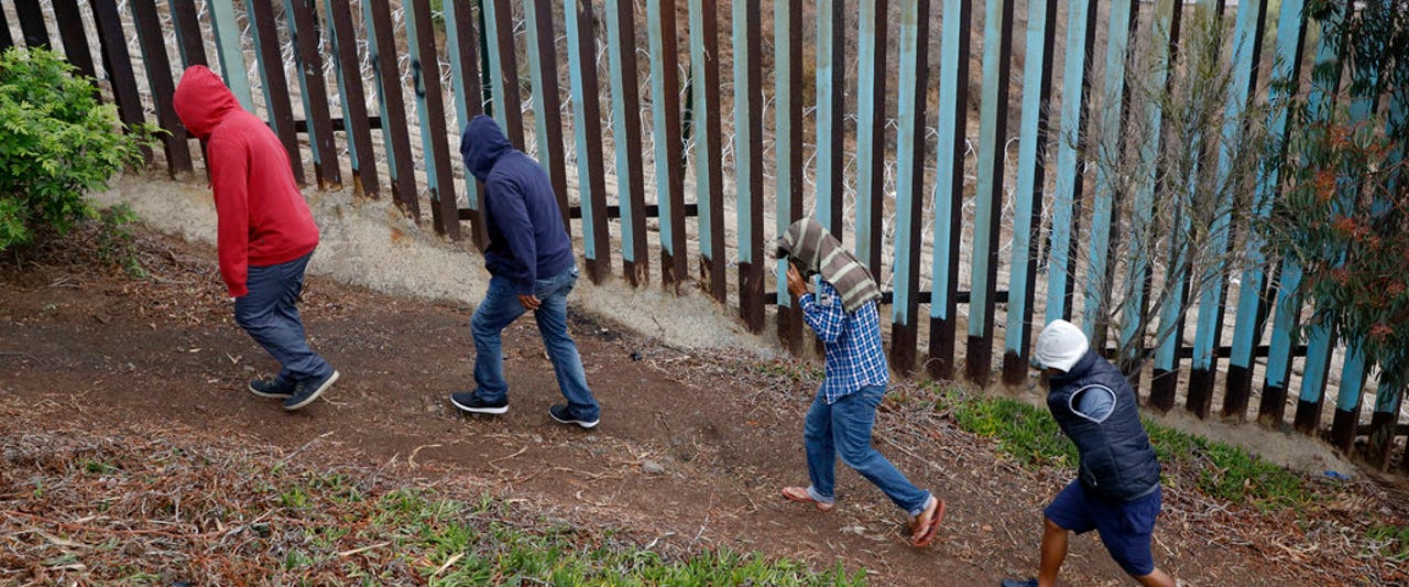 Pregnant caravan migrant scales border wall, gives birth on American soil