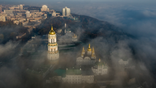 FILE - In this Saturday, Nov. 10, 2018 file photo, an aerial photo of the thousand-year-old Monastery of Caves, also known as Kiev Pechersk Lavra, the holiest site of Eastern Orthodox Christians is taken through morning fog during sunrise in Kiev, Ukraine. Ukraine's president has promised the country's Orthodox Christian faithful they will be free to remain part of the Russian Orthodox Church after the creation of an independent Ukrainian church. Amid deteriorating ties with Moscow, Kiev has been pushing for the creation of an autocephalous Ukrainian Orthodox Church that would be free of control from the Moscow Patriarchate. (AP Photo/Evgeniy Maloletka, File)