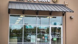 Eugene, Oregon, USA - July 20, 2014: UPS Store location in Eugene, Oregon. UPS Store is a subsidiary of the United Parcel Service (UPS) and is a way for customers to ship packages domestically as well as worldwide.
