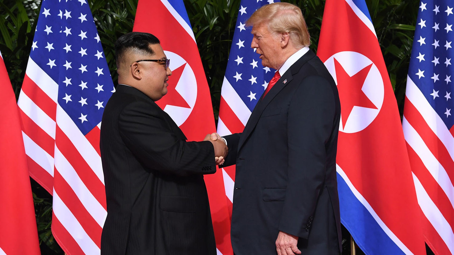 North Korean leader Kim Jong Un shakes hands with U.S. President Donald Trump at the start of their historic U.S.-North Korea summit on Sentosa Island in Singapore, June 12, 2018.