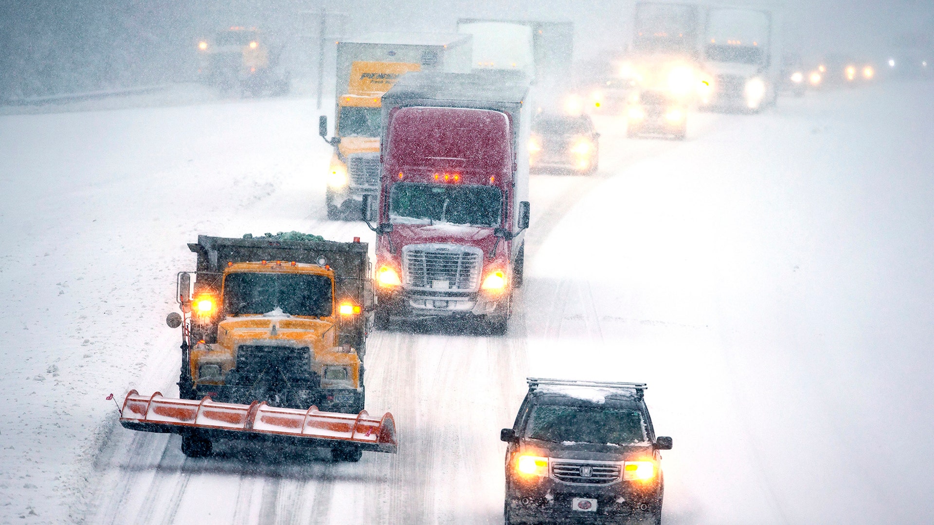 Snow-covered roads made traffic move slowly on I-85 in Lexington, N.C., Dec. 9, 2018.
