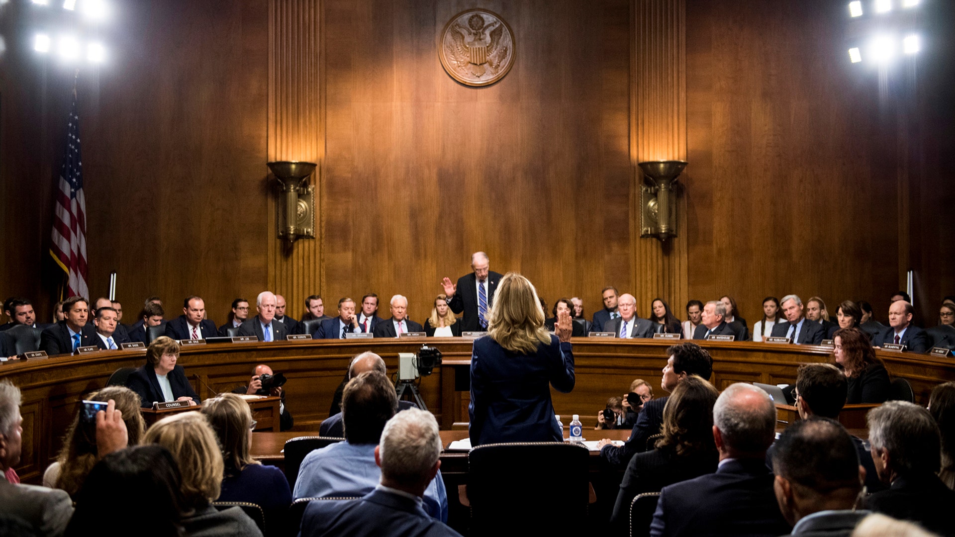 Christine Blasey Ford is sworn in by Senate Judiciary Committee Chairman Chuck Grassley at the start of her testimony on Capitol Hill in Washington, September 27, 2018. 