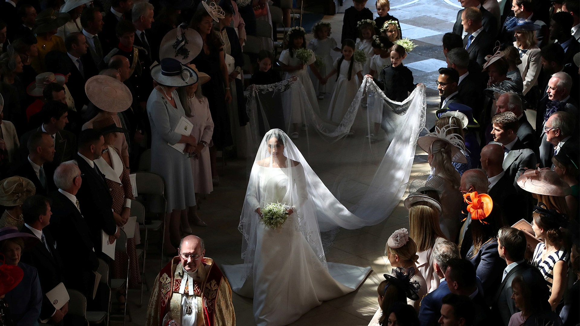 Meghan Markle walks down the aisle as she arrives in St George's Chapel at Windsor Castle for her wedding to Prince Harry in Windsor, Britain, May 19, 2018. 