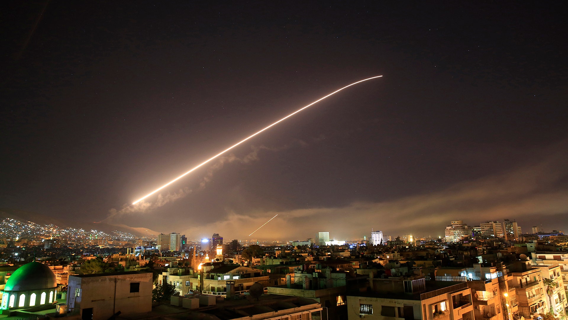 The Damascus sky lights up with missile fire as the U.S. launches an attack on Syria targeting different parts of the capital, April 14, 2018. 