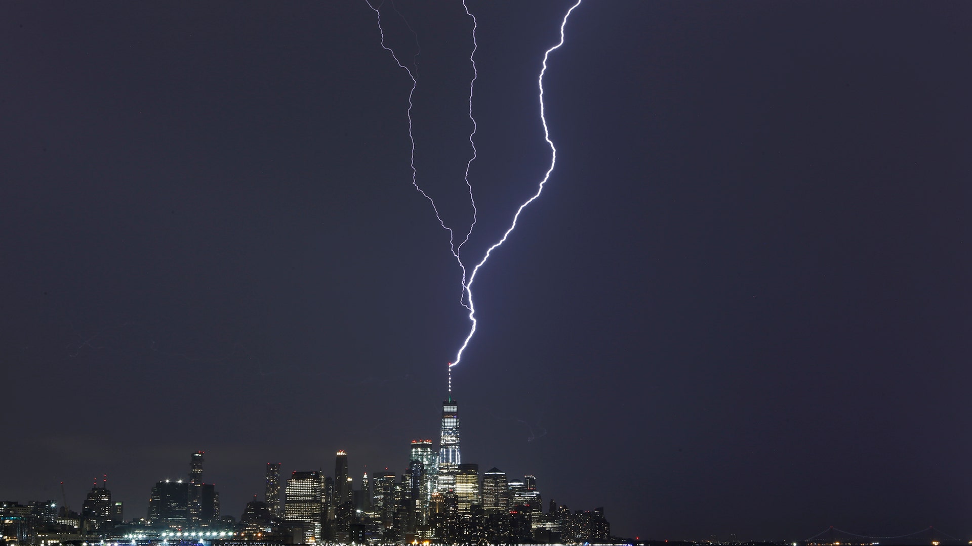 A lightning bolt strikes One World Trade Center during an electrical storm over New York City, October 2, 2018. (Photo by Gary Hershorn)