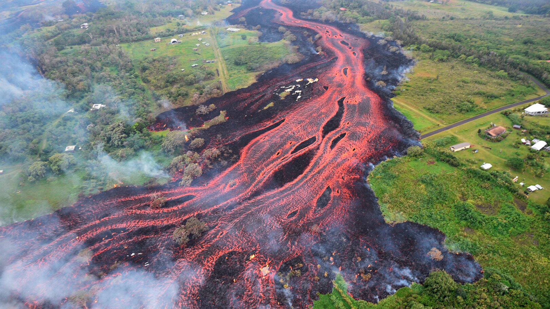 Lava flows from fissures of the Kilauea volcano near Pahoa, Hawaii, May 19, 2018. 