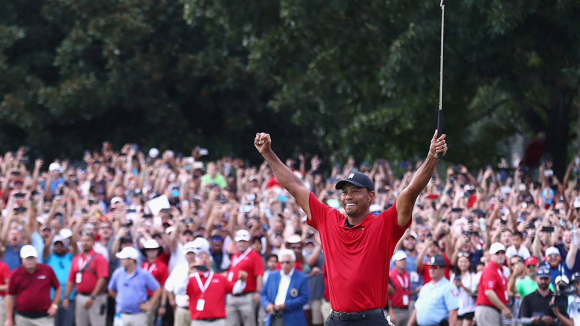 Tiger Woods of the United States celebrates making a par on the 18th green to win the TOUR Championship at East Lake Golf Club in Atlanta, September 23, 2018.