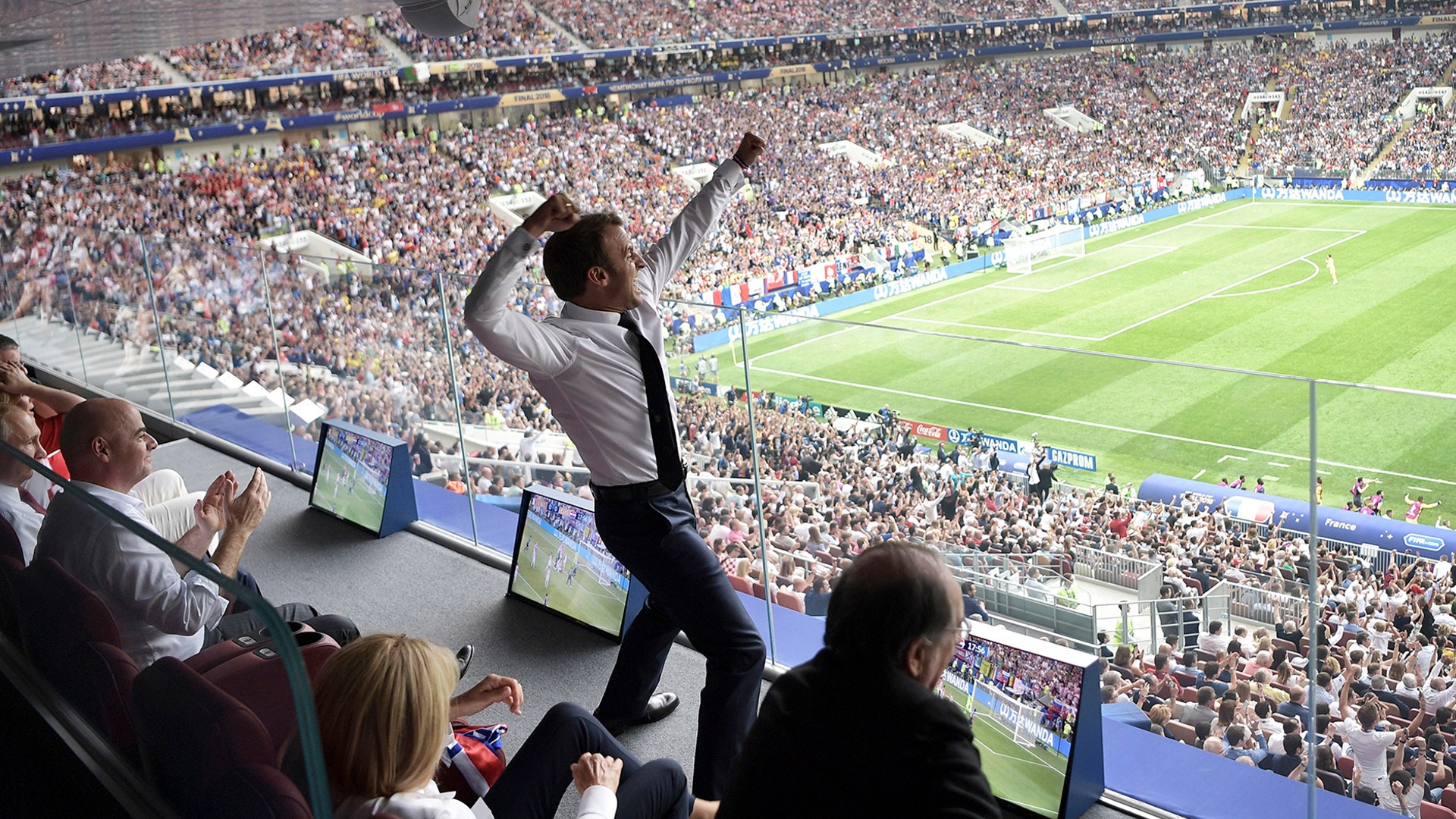 French President Emmanuel Macron celebrates as France defeats Croatia in the 2018 soccer World Cup final in Moscow, July 15, 2018. 