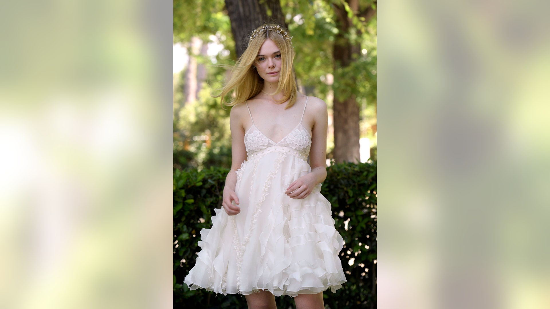 Elle Fanning sparkles in white at The Neon Demon photocall in Rome, Italy on June 6, 2016. Go to X17Online for more pics of Elle.