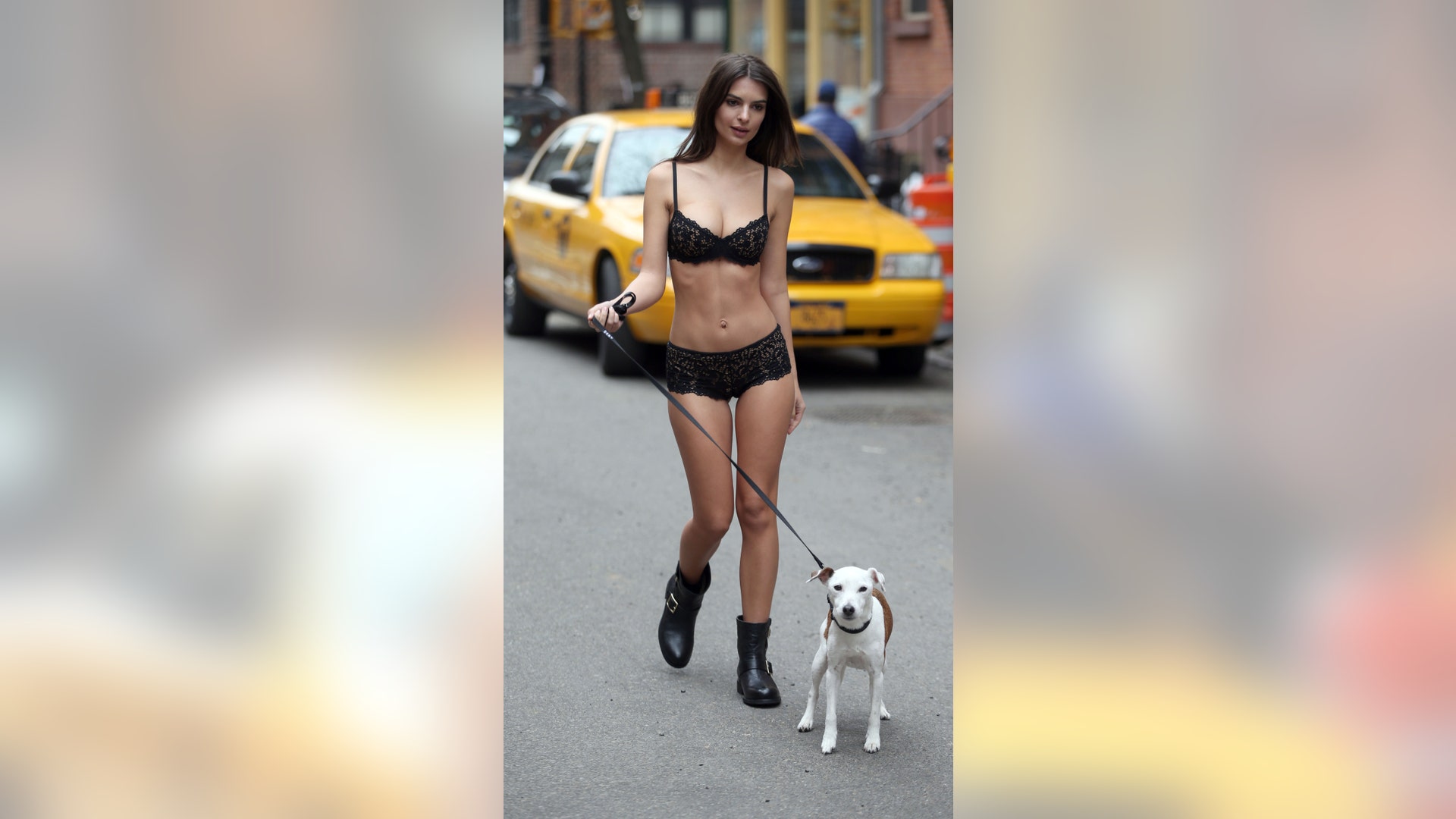 Emily Ratajkowski stopped traffic in NYC in nothing but lingerie while walking a dog. No, the model isn't making a fashion statement -- her risque look was for a commercial shoot for a DKNY campaign. Click here for more pics of the model on ETonline.com.