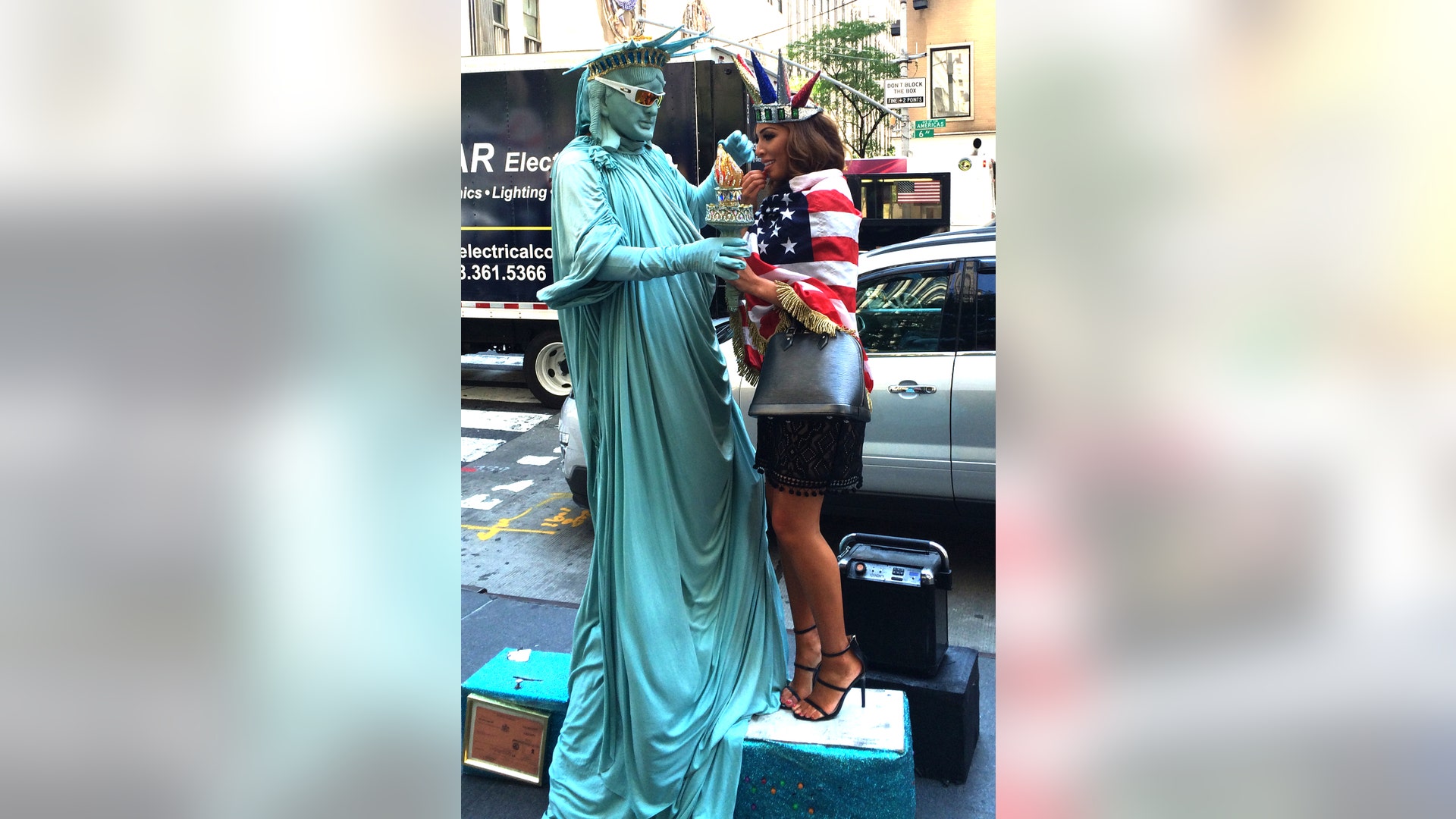 Farrah Abraham is giving Lady Liberty a run for her money. The reality star stopped a street performer in New York City's Rockefeller Center and tried on their outfit. Who do you think makes a better Staue of Liberty?