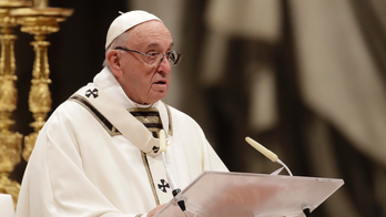 Pope Francis, in Christmas Mass, urges world to set aside 'partisan interests'