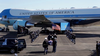 George H.W. Bush casket departs Texas with 21-gun salute