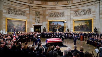 As Washington remembered Bush, politics in the Capitol was on hold -- sort of