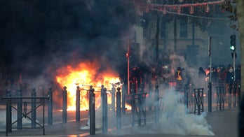 Paris tries to clean up after protests; French officials call for unity