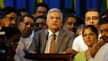 Sri Lankan president reinstates the prime minister he sacked