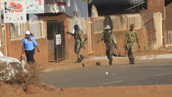 Zimbabwe inquiry finds army, police killed 6 during protest