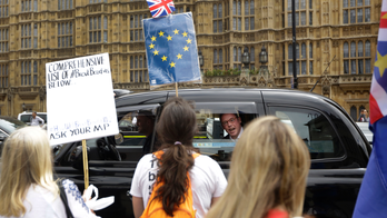 The Latest: May calls Brexit deal vote for week of Jan 14