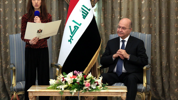 Nobel laureate returns to Iraq, pledges to work for peace