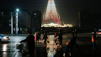 World's tallest empty hotel lit up with N. Korean propaganda