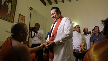 Sri Lanka's disputed prime minister resigns to end impasse