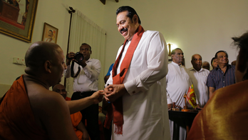 Sri Lanka's disputed prime minister resigns to end impasse