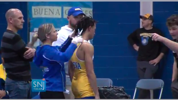 New Jersey wrestler who was forced to cut dreadlocks returns to the mat for first time since incident